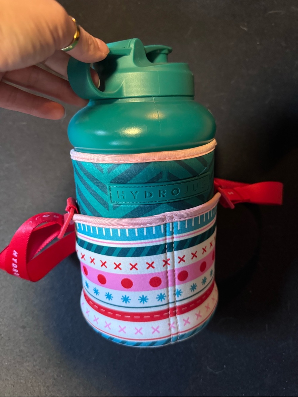 HydroJug teal green with pink and red patterned sleeve